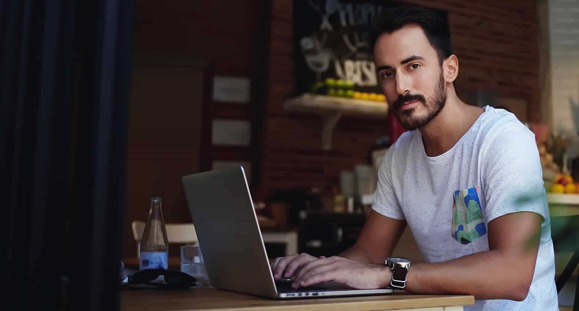 Man programming on laptop